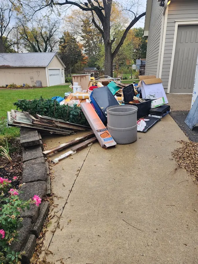 Dumpster being loaded with debris for Residential Dumpster Rental in Glendale
